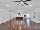 Spacious kitchen with large island and dark wood cabinets at 3907 E Lawyers Rd, Monroe, NC 28110