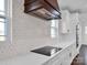 Kitchen with modern range and white cabinets at 3907 E Lawyers Rd, Monroe, NC 28110