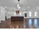 Modern kitchen with island and hardwood floors at 3907 E Lawyers Rd, Monroe, NC 28110