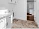 Bright laundry room with white cabinets and view to pantry at 3907 E Lawyers Rd, Monroe, NC 28110