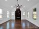 Living room with hardwood floors and a fireplace at 3907 E Lawyers Rd, Monroe, NC 28110