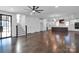 Open living room with hardwood floors and staircase at 3907 E Lawyers Rd, Monroe, NC 28110