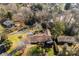 Aerial view of a home featuring a long driveway, trampoline, and mature trees in a well-established neighborhood at 946 Scotch Dr, Gastonia, NC 28054