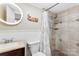 Bathroom featuring a shower with decorative tile, a modern sink, and a stylish design at 946 Scotch Dr, Gastonia, NC 28054