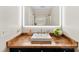 Bathroom featuring wooden countertop, undermount sink, modern LED mirror, and gold hardware at 946 Scotch Dr, Gastonia, NC 28054