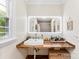 A stylish bathroom features an undermount sink, wood countertop, framed LED mirror, and a view to the backyard at 946 Scotch Dr, Gastonia, NC 28054