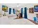 Bedroom features hardwood floors, blue drapes, a ceiling fan, a white dresser and wall art at 946 Scotch Dr, Gastonia, NC 28054