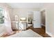 Bedroom featuring a dressing table, large window and view into the Bedroom through a mirrored closet door at 946 Scotch Dr, Gastonia, NC 28054