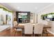 This open dining room features a stone fireplace, mounted television and an adjacent kitchen at 946 Scotch Dr, Gastonia, NC 28054