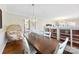 Elegant dining room with wooden table, seating for six, and a view into the kitchen and living spaces at 946 Scotch Dr, Gastonia, NC 28054