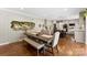 The dining room features a wooden table with bench seating and a mirror with holiday greenery at 946 Scotch Dr, Gastonia, NC 28054