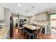 Kitchen showcasing granite countertops, stainless steel appliances, and dark stained island with seating at 946 Scotch Dr, Gastonia, NC 28054