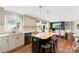 This kitchen features an island with seating, stainless steel appliances, and stone countertops at 946 Scotch Dr, Gastonia, NC 28054