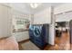 Well-lit laundry room featuring a sink, storage cabinets, and a modern washer and dryer at 946 Scotch Dr, Gastonia, NC 28054