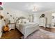 Comfortable main bedroom with accent lighting, neutral colors, hardwood floors and ensuite bathroom at 946 Scotch Dr, Gastonia, NC 28054