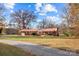 Brick ranch home with a metal roof and spacious yard at 955 Goodnight Rd, Salisbury, NC 28147