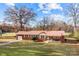 Brick ranch home with a metal roof and spacious yard at 955 Goodnight Rd, Salisbury, NC 28147