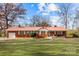 Brick ranch home with a metal roof and spacious yard at 955 Goodnight Rd, Salisbury, NC 28147