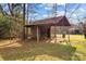 Rustic wooden shed with partial roof cover at 955 Goodnight Rd, Salisbury, NC 28147