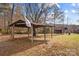 Rustic wooden shelter and barn in a grassy yard at 955 Goodnight Rd, Salisbury, NC 28147