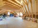 Unfinished attic space with exposed wood beams and ample room for storage at 1140 Inlet Pointe Rd, Salisbury, NC 28146