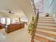Open basement area with a large leather couch and stairs leading up at 1140 Inlet Pointe Rd, Salisbury, NC 28146