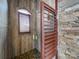 A walk-in shower featuring wood-grain walls, a stone wall accent, and a stone pebble floor at 1140 Inlet Pointe Rd, Salisbury, NC 28146