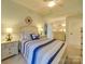 Nautical themed bedroom featuring a queen bed with striped bedding and stylish coastal decor at 1140 Inlet Pointe Rd, Salisbury, NC 28146
