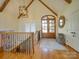 A grand foyer featuring wood floors, a chandelier, and double doors at 1140 Inlet Pointe Rd, Salisbury, NC 28146