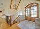A grand foyer featuring wood floors, a chandelier, and double doors at 1140 Inlet Pointe Rd, Salisbury, NC 28146
