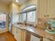 Kitchen with custom cabinets, granite countertops, stainless steel appliances, and a view of the backyard at 1140 Inlet Pointe Rd, Salisbury, NC 28146