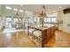 Spacious kitchen with large island, granite countertops, stainless steel appliances, and hardwood floors at 1140 Inlet Pointe Rd, Salisbury, NC 28146