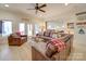 Cozy basement living room with a large leather couch and a ceiling fan at 1140 Inlet Pointe Rd, Salisbury, NC 28146