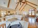 Open concept living room with vaulted ceilings, exposed beams, hardwood floors, and a fireplace at 1140 Inlet Pointe Rd, Salisbury, NC 28146