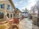 Spacious patio with outdoor seating overlooking backyard and lake at 1140 Inlet Pointe Rd, Salisbury, NC 28146