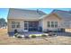 Private backyard with screened porch, patio, and beautifully landscaped yard at 2353 Abundance Ln, Waxhaw, NC 28173