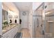 Bathroom boasts double sinks, granite countertops, and a large walk-in shower at 2353 Abundance Ln, Waxhaw, NC 28173
