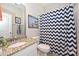 Bathroom with granite vanity, toilet and zig-zag patterned shower curtain at 2353 Abundance Ln, Waxhaw, NC 28173
