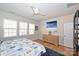 Bedroom with dresser, large bed, and plenty of natural light at 2353 Abundance Ln, Waxhaw, NC 28173