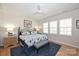 Spacious bedroom with a large bed, nightstands, and plenty of natural light at 2353 Abundance Ln, Waxhaw, NC 28173