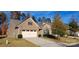 Exterior view of charming craftsman style home with attached garage and manicured lawn at 2353 Abundance Ln, Waxhaw, NC 28173