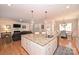 Open kitchen with large island, granite counters and stainless steel appliances at 2353 Abundance Ln, Waxhaw, NC 28173