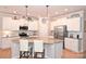 Modern kitchen with white cabinets, granite counters, and a large island at 2353 Abundance Ln, Waxhaw, NC 28173