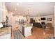 Open kitchen features granite countertops, stainless steel appliances, and an island at 2353 Abundance Ln, Waxhaw, NC 28173