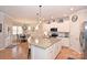 Modern kitchen with white cabinets, granite countertops, and island at 2353 Abundance Ln, Waxhaw, NC 28173