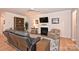 Cozy living room with hardwood floors, fireplace, and comfortable seating at 2353 Abundance Ln, Waxhaw, NC 28173