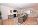 Relaxing living room with hardwood floors, fireplace, and comfortable seating at 2353 Abundance Ln, Waxhaw, NC 28173