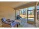 Relaxing screened porch with wicker furniture and view of backyard at 2353 Abundance Ln, Waxhaw, NC 28173