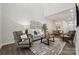 Bright open-concept living room features high ceilings and wood flooring at 3034 Finchborough Ct # 233, Charlotte, NC 28269