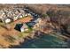 Community overview showing houses near a lake at 310 Pine St, Locust, NC 28097